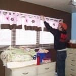 Hanging curtains in the nursery