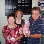 B at the airport with grandpa, grandma, and momma